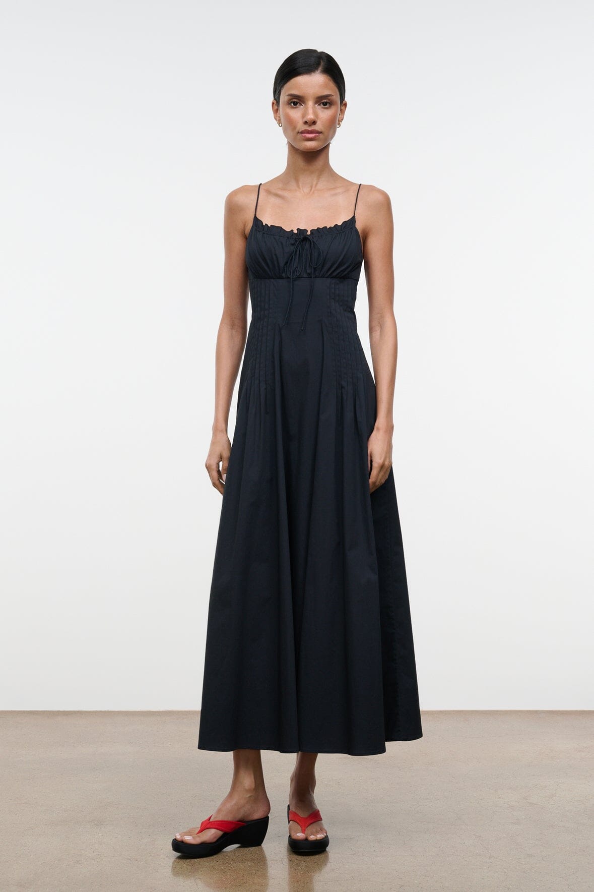 Black midi dress with spaghetti straps and gathered neckline