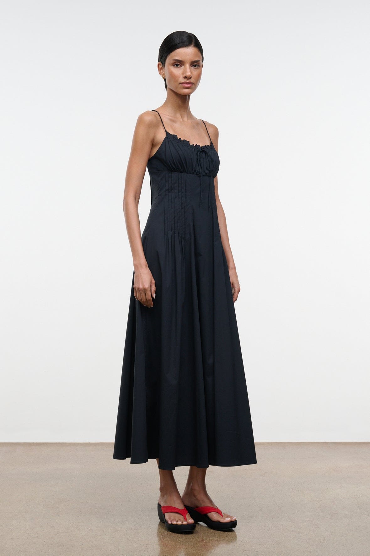 Black midi sundress with spaghetti straps and gathered bodice, flared skirt