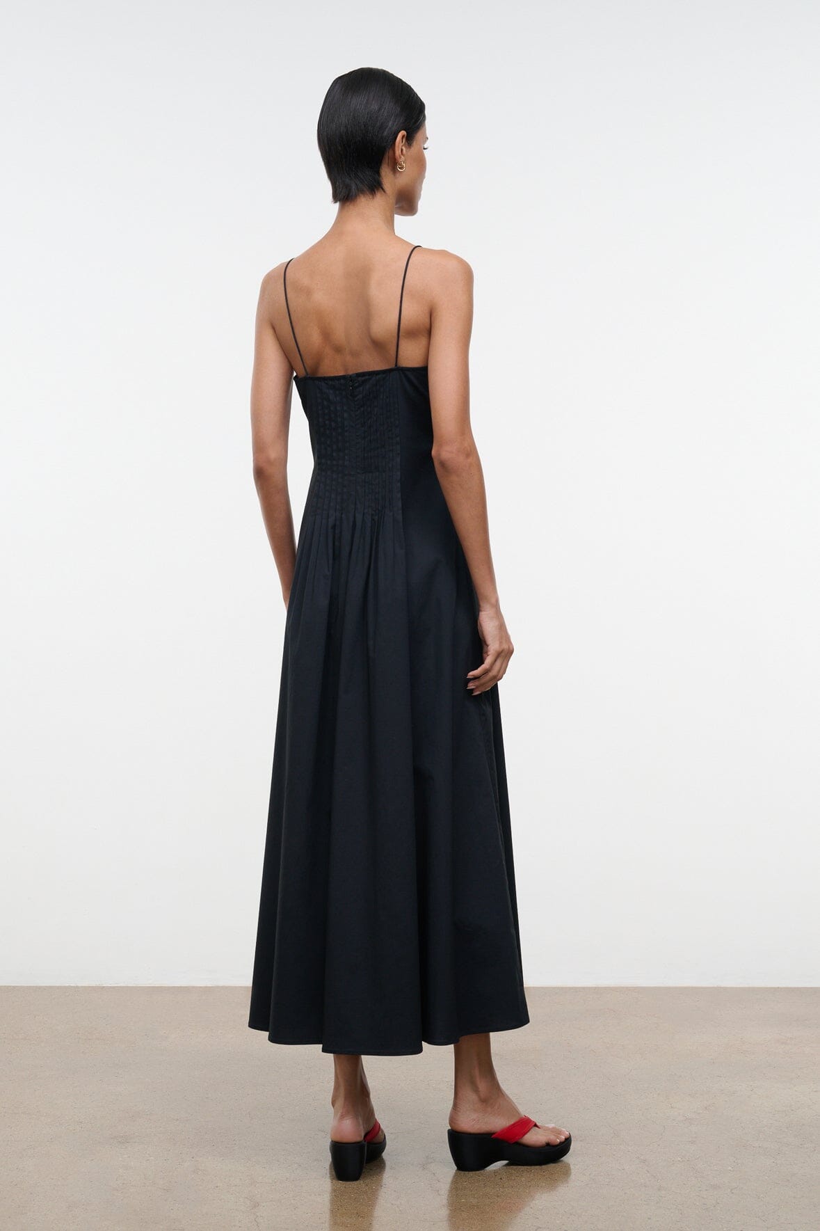 Black midi dress with spaghetti straps and open back detail