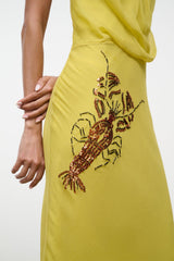 Citron yellow halter dress with embroidered insect motif on skirt