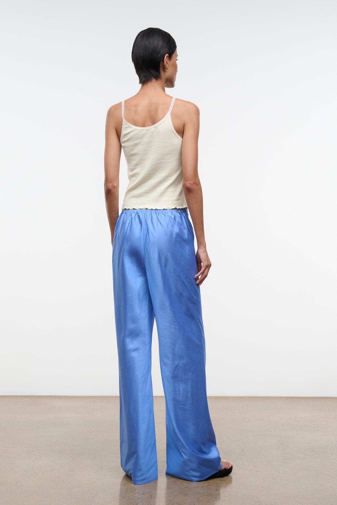 Back view of light blue silk dupioni wide-leg pants with relaxed fit