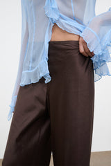 Dark brown wide-leg pants with smooth waistband and roomy straight-leg cut