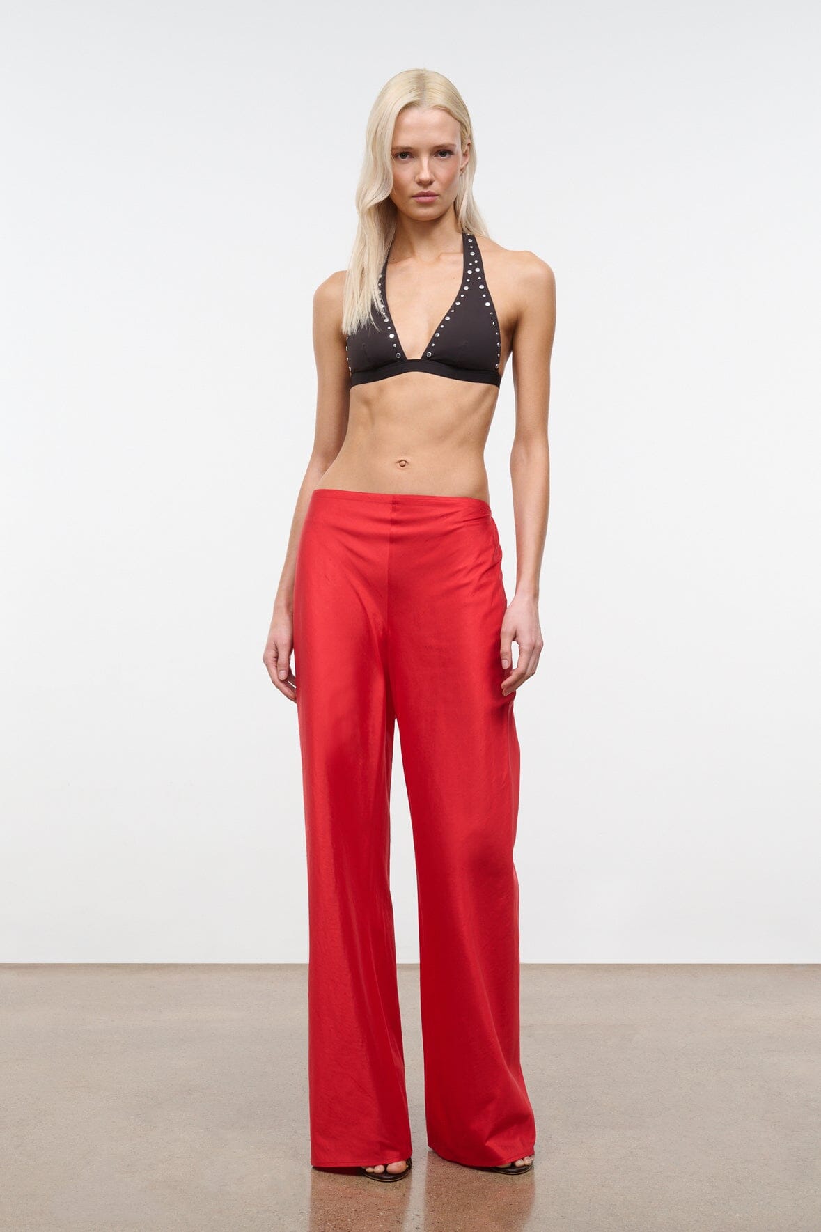 Red wide-leg pants with elastic waistband and full-length drape