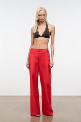 Red wide-leg pants with elastic waistband and full-length drape