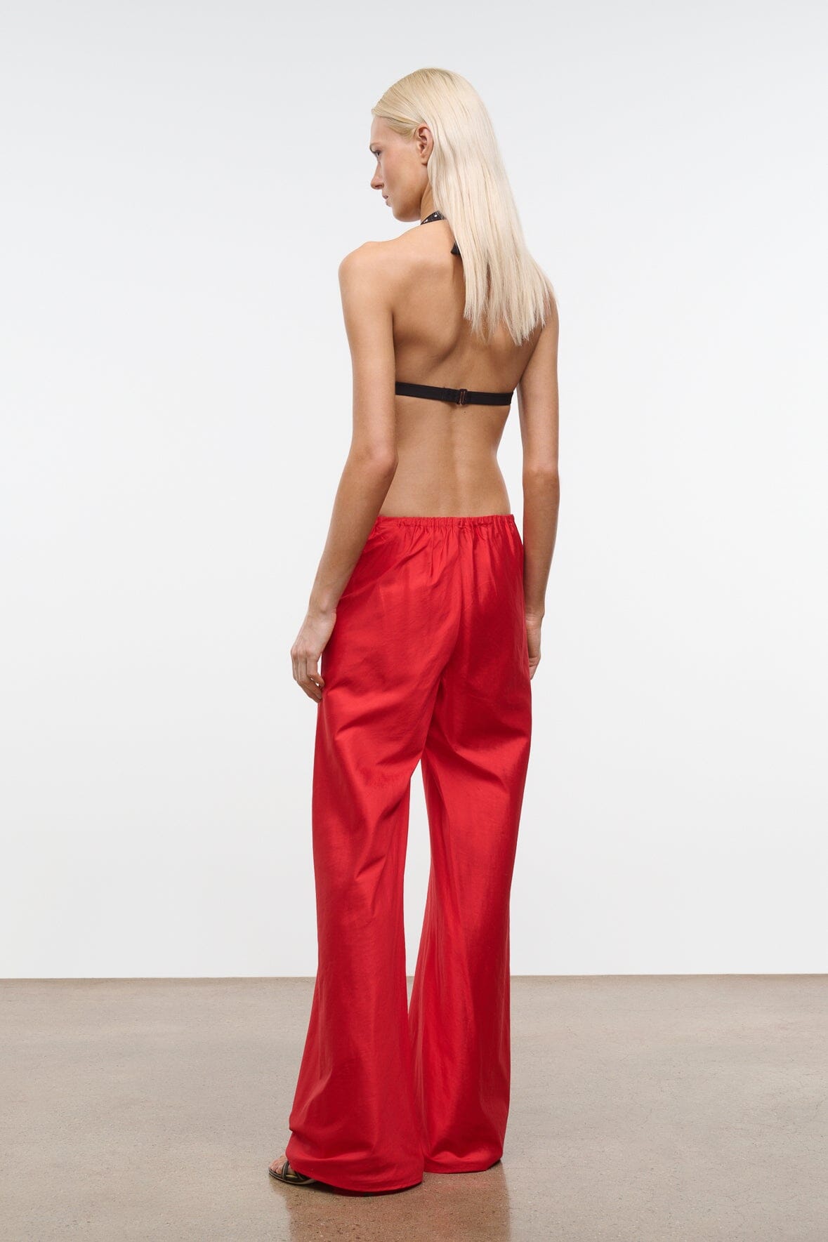 Side view red silk dupioni wide-leg pants with elastic waistband