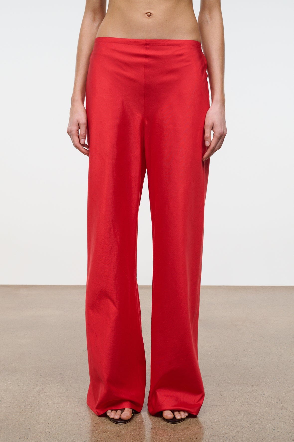 Front view red silk dupioni flared pants with elastic waist
