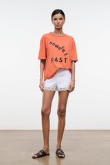 Orange oversized crew-neck T-shirt with 'NOWHERE FAST' front graphic print