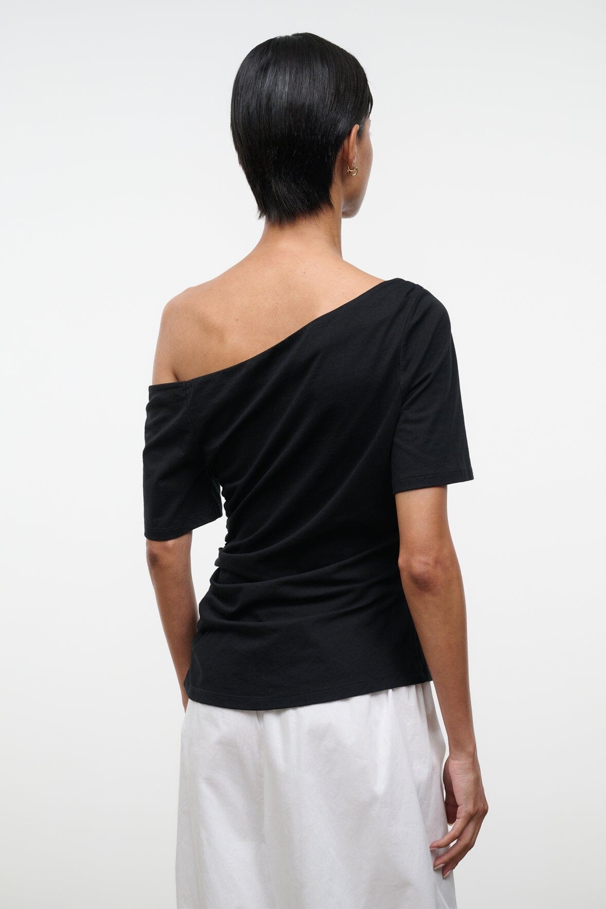 Black Carine top with draped off-shoulder neckline and short sleeves, back view