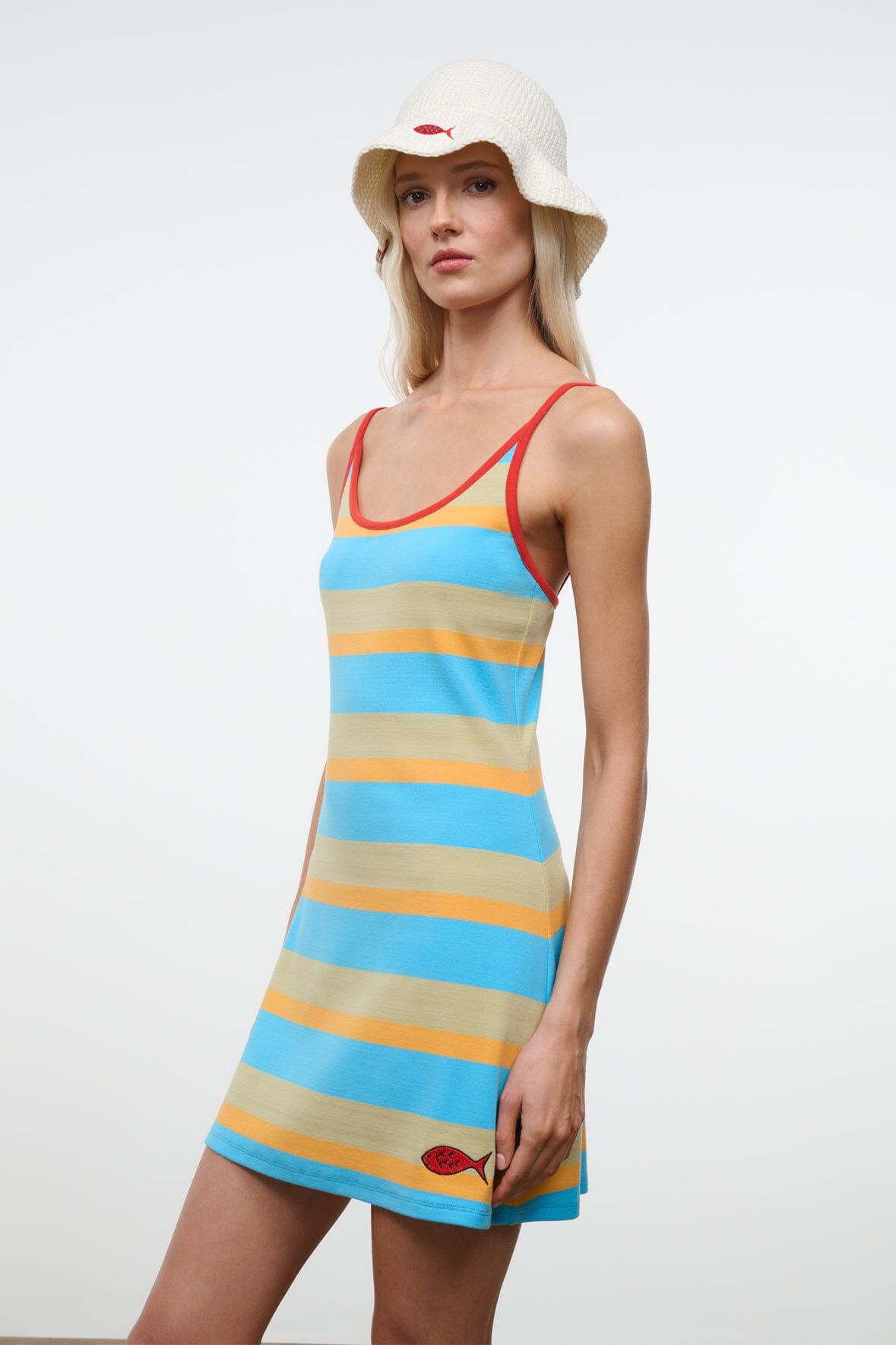 Striped mini tank dress with red trim and small fish logo on hem