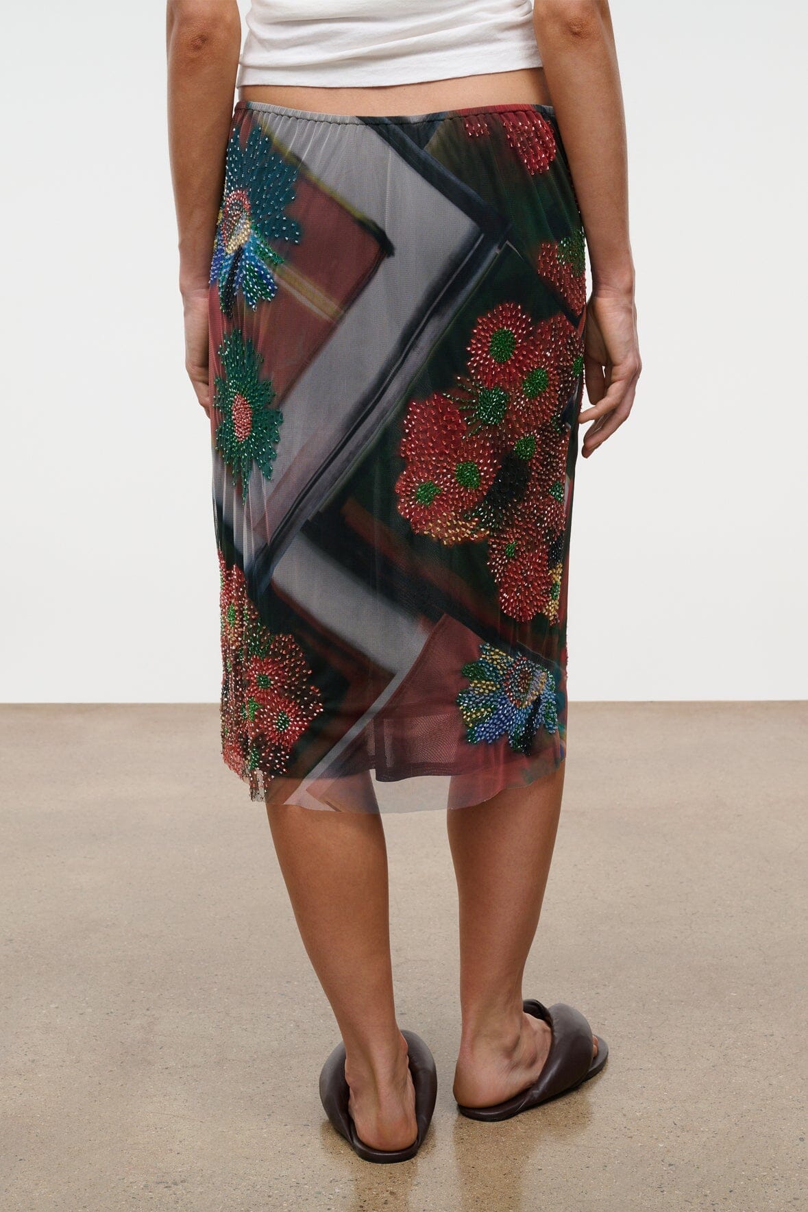LUCIA skirt side view in sheer multicolor fabric with beaded floral designs