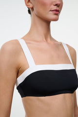 Black and white bikini top with square neckline, thin straps, and white trim