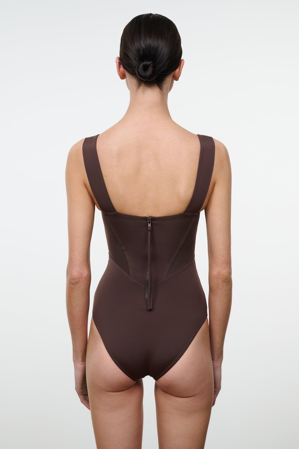 Dark one-piece swimsuit with scoop back, thin straps, and center back closure