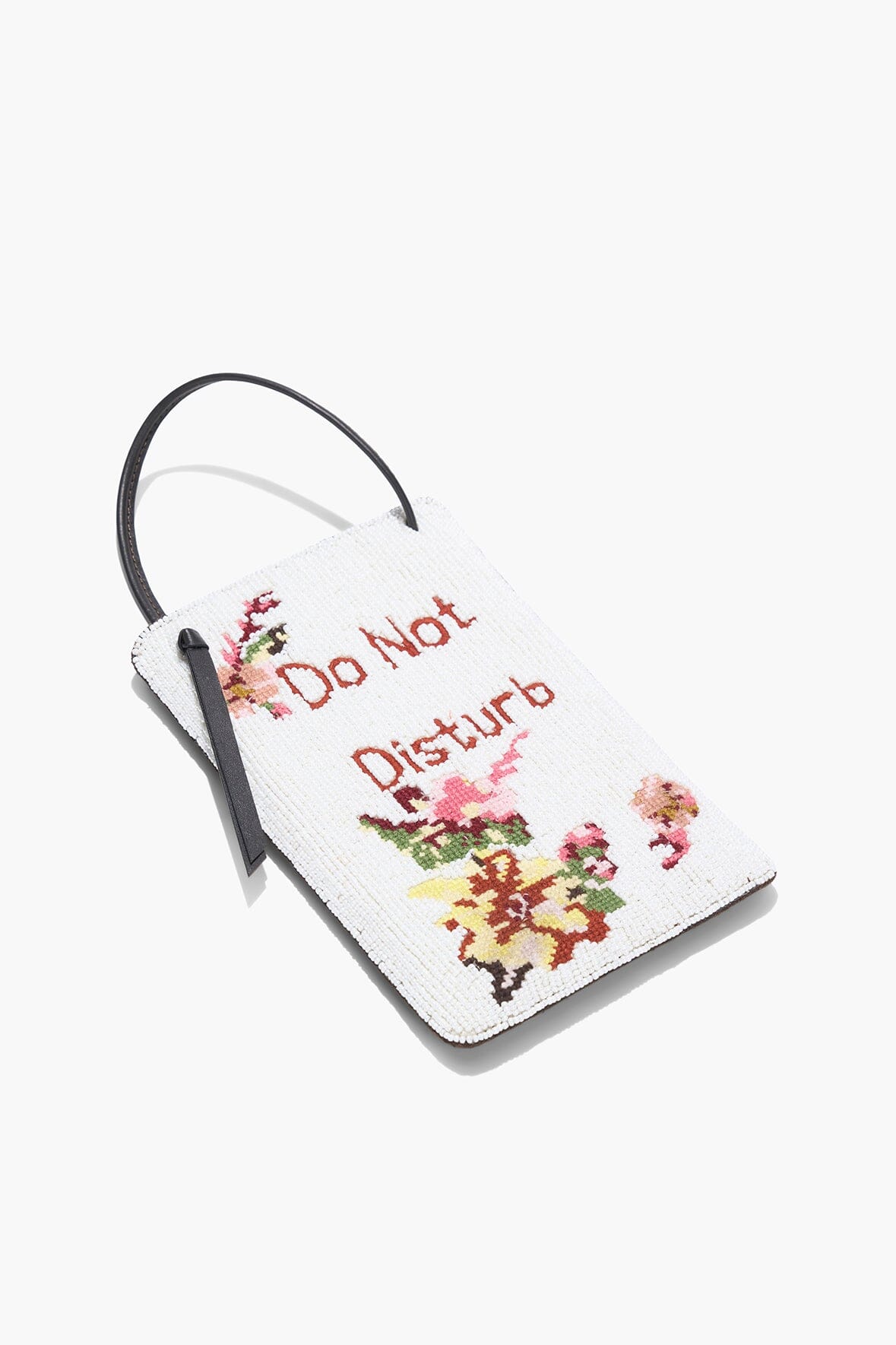 Angled white beaded door sign with 'Do Not Disturb' lettering and floral accents