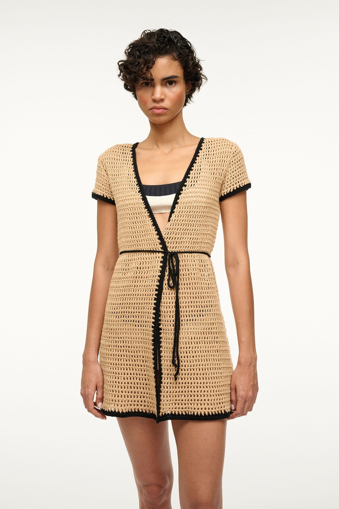 Crochet coverup dress with V-neck black trim and braided drawstring