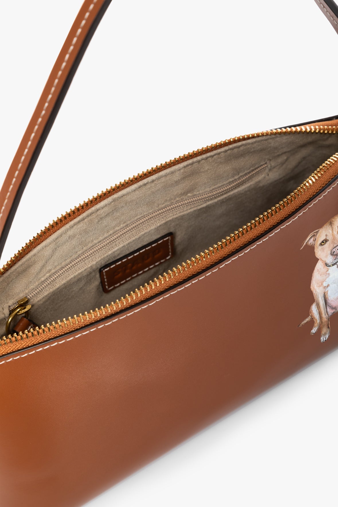 Tan zipper-top bag with inner pocket and leather patch, dog graphic