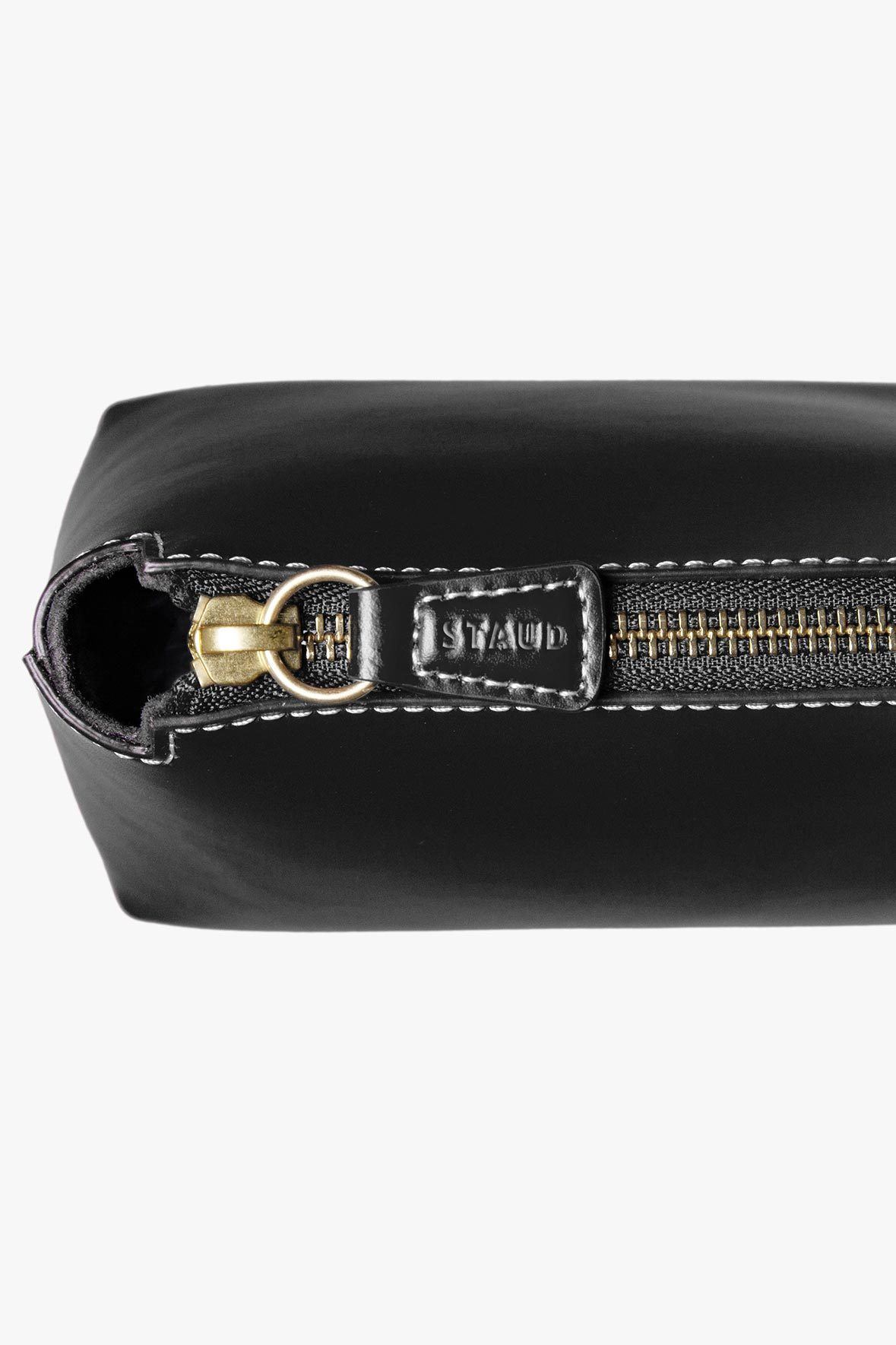 Mini black leather bag with top handle, gold-tone clasp, and stitched trim