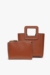 Saddle brown mini leather bag with front flap and matching small pouch