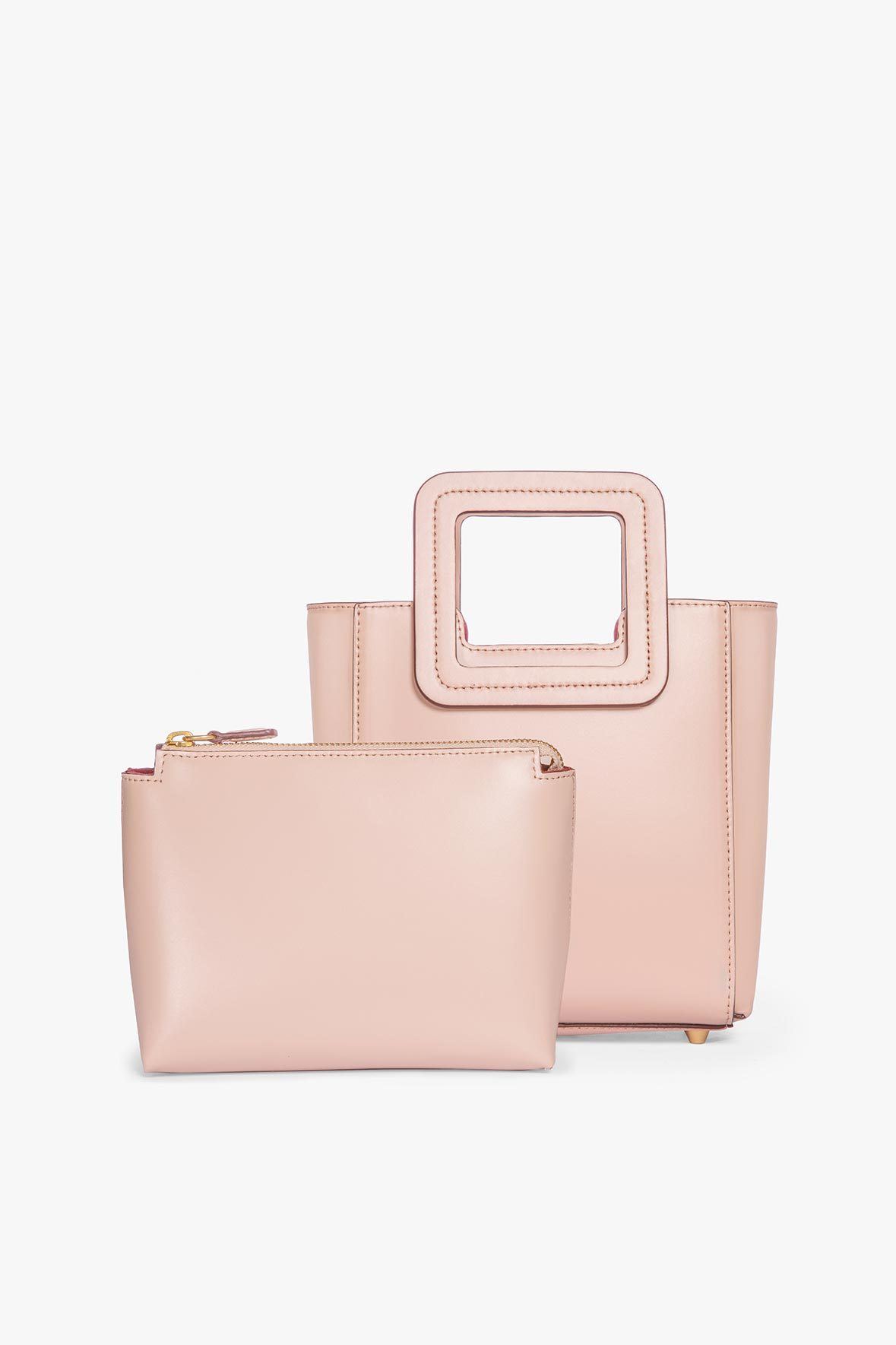 Blush leather mini tote bag with zip pouch detail and top handle