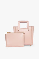 Blush leather mini tote bag with zip pouch detail and top handle