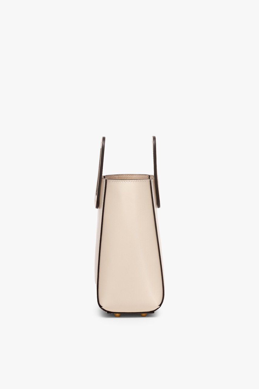 Mini cream leather bag, front view with two short handles