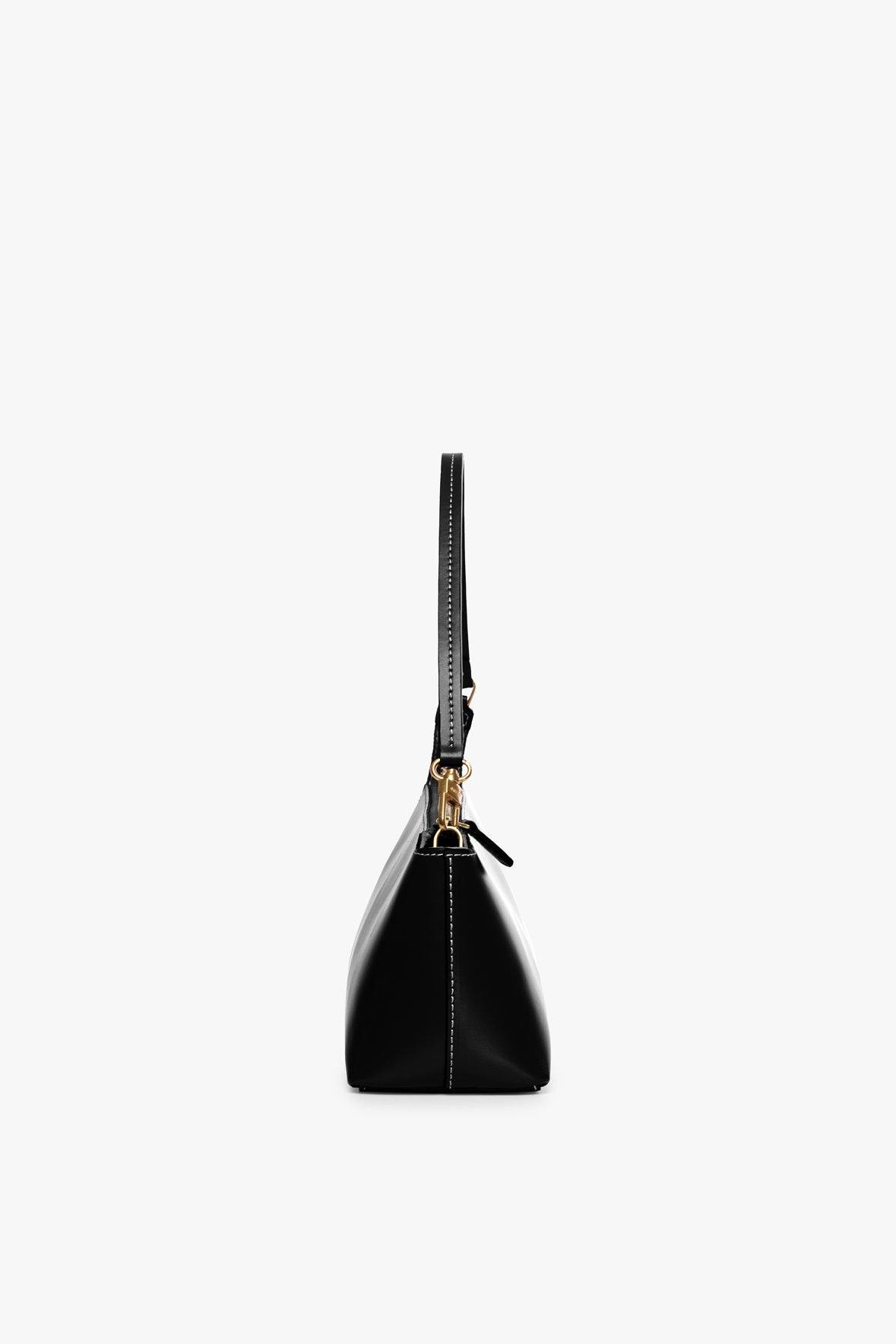 Black Kaia top-handle bag with zipper closure and gold hardware