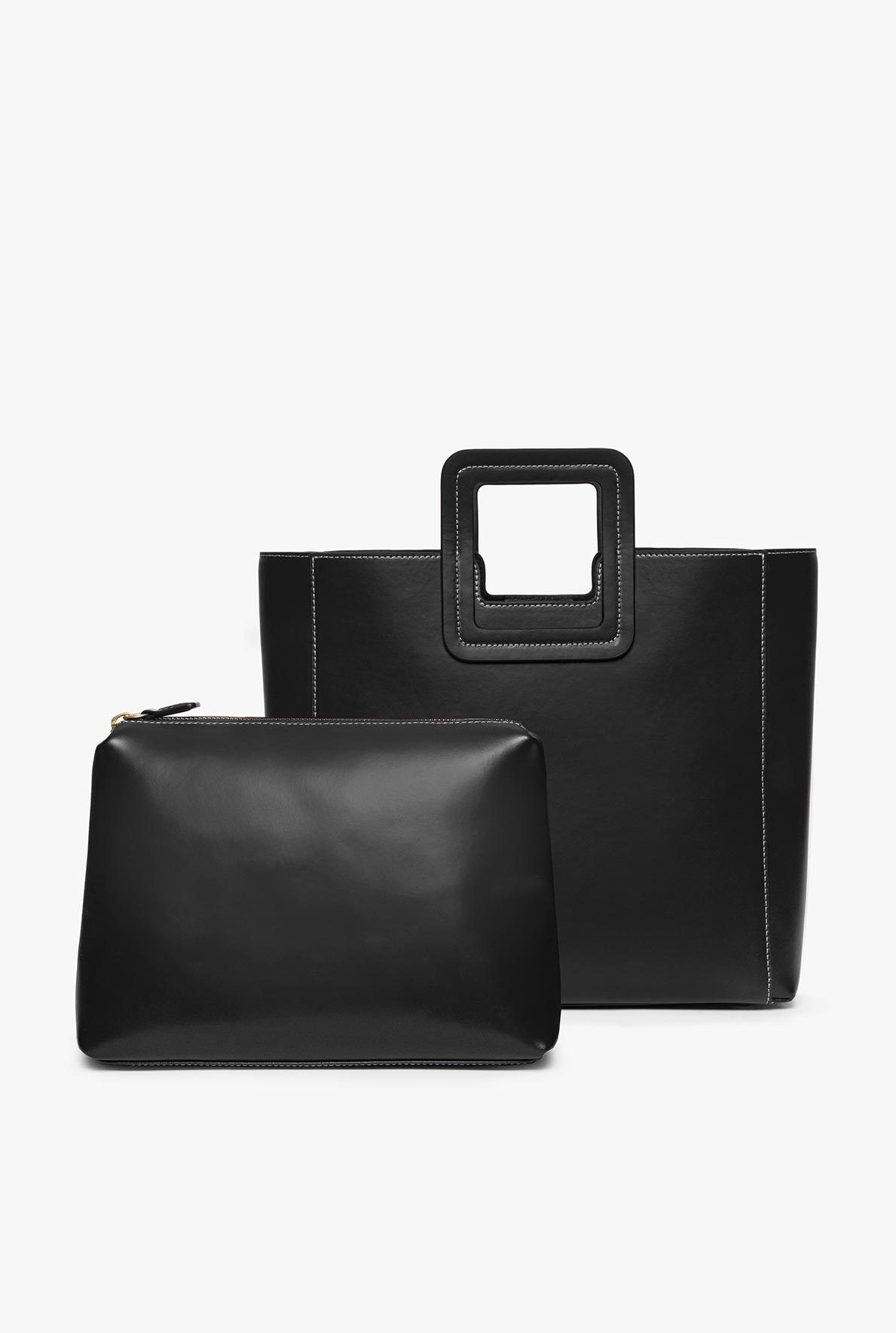 Black leather tote bag with detachable zip pouch in matching black