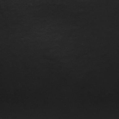 Black leather bag close-up showing smooth surface
