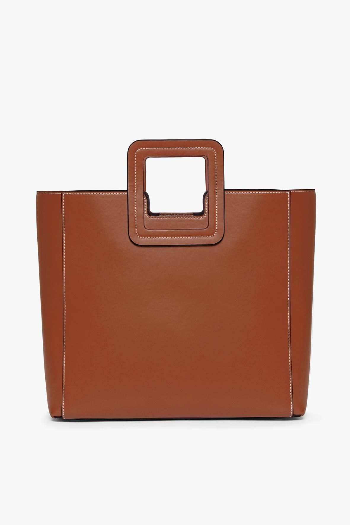 Tan leather bag with top handle and square front cutout
