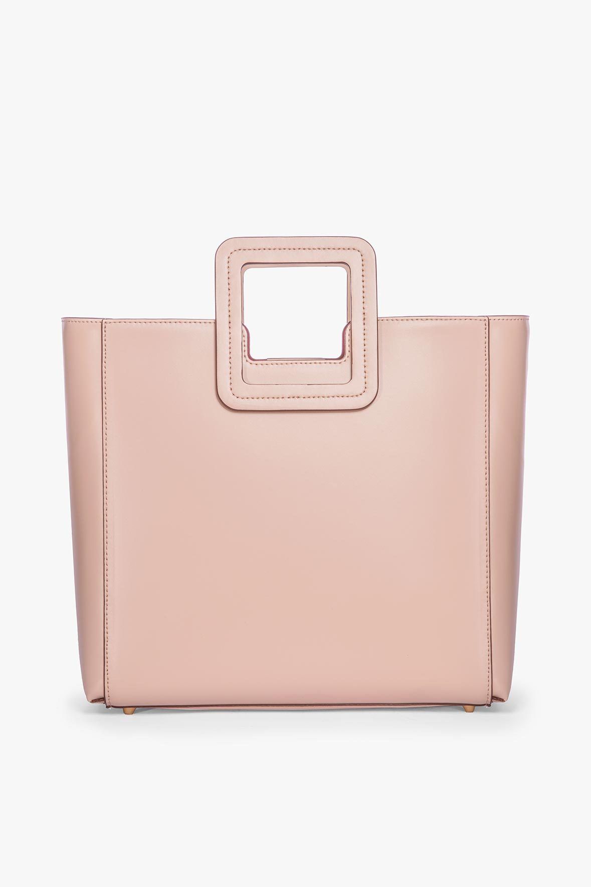 Blush leather tote bag with structured square top handles and stitched trim