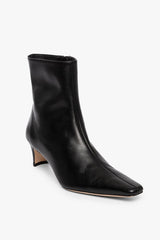 Black ankle boot with pointed toe and slim low heel