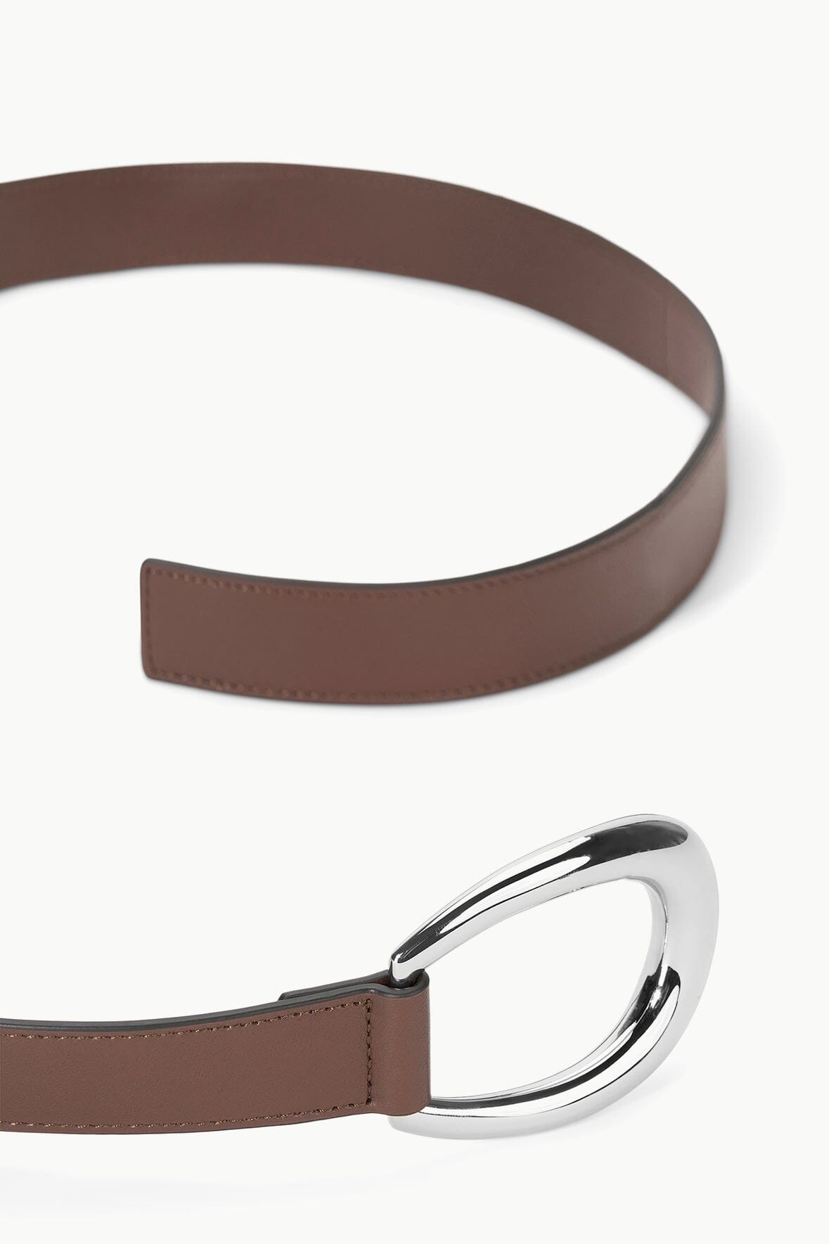 Mahogany brown leather wrap belt with oversized silver oval buckle, close-up