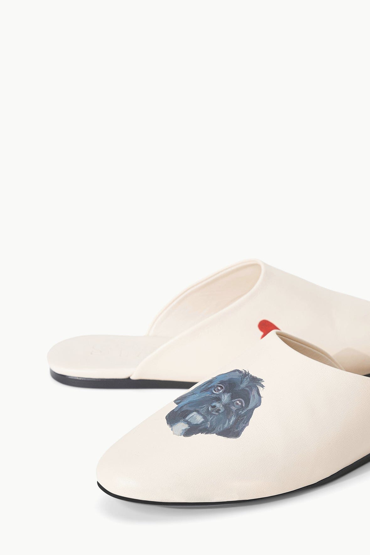 Cream slide slippers with blue graphic and black rubber sole