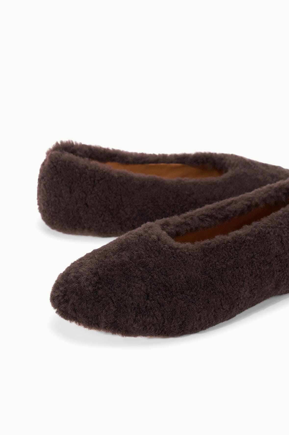 Espresso shearling ballet flat showing interior lining at the opening