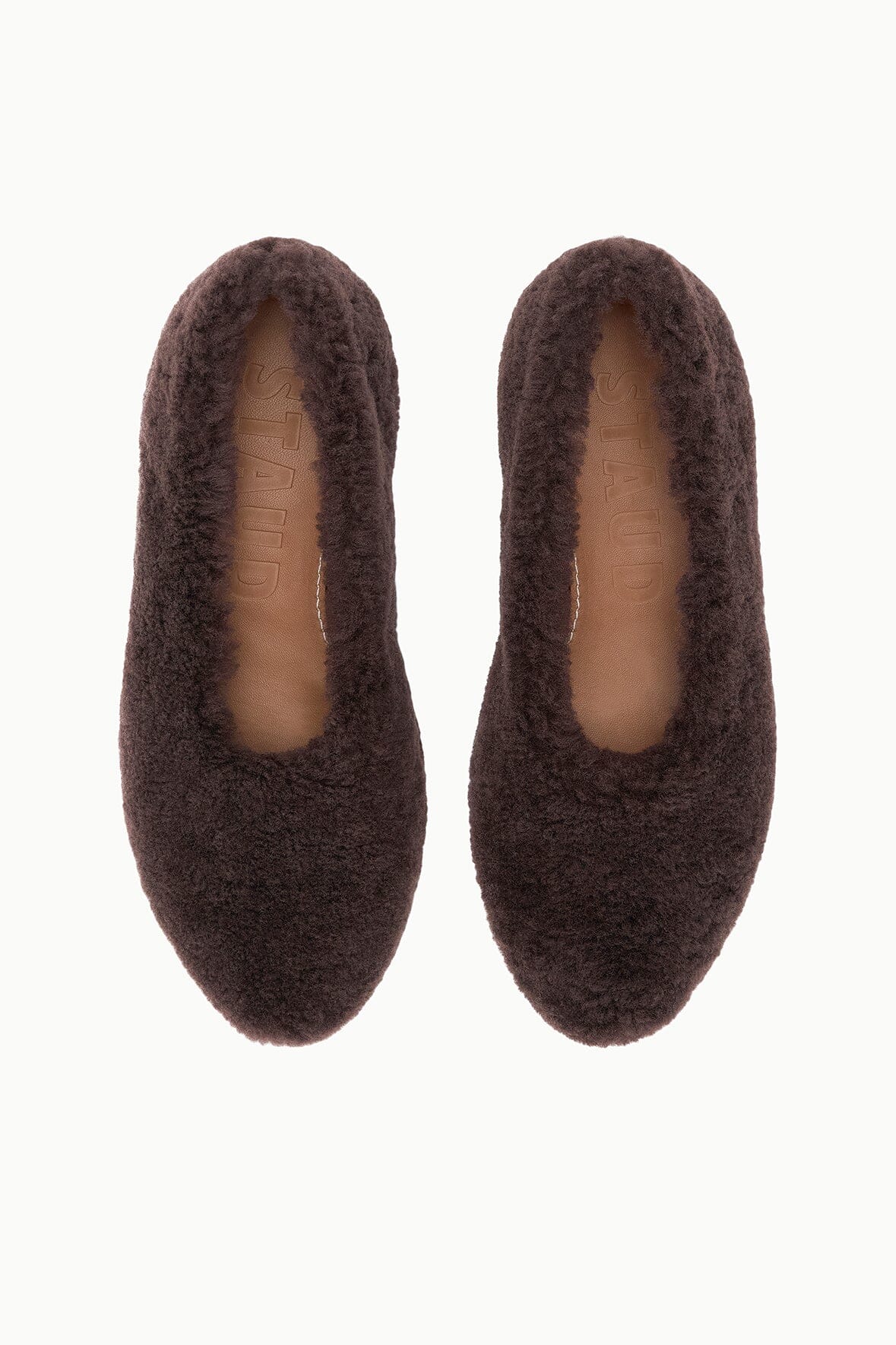 Pair of espresso shearling ballet flats with oval cutout openings