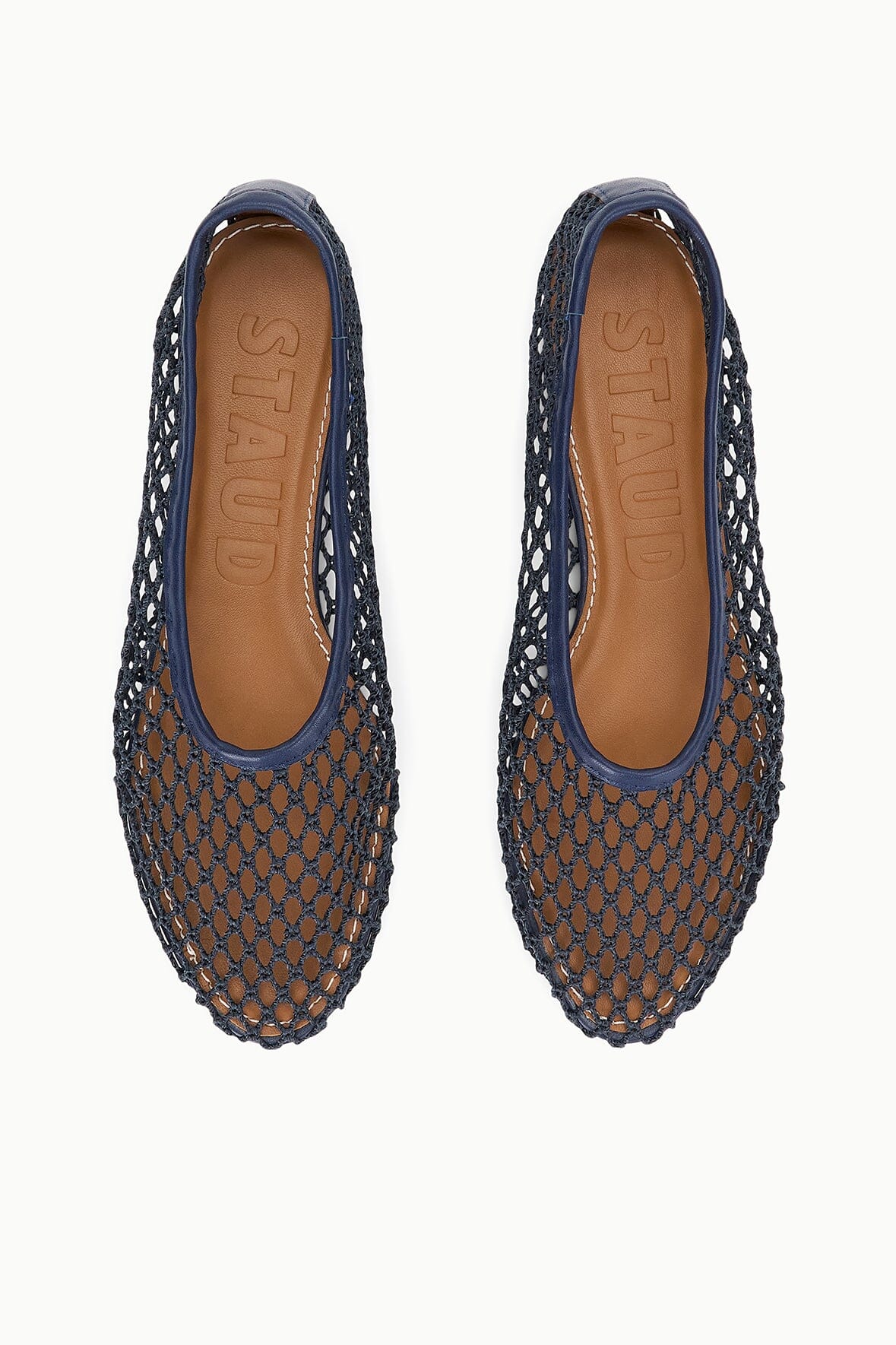 Pair of navy mesh ballet flats with rounded toe and slip-on collar