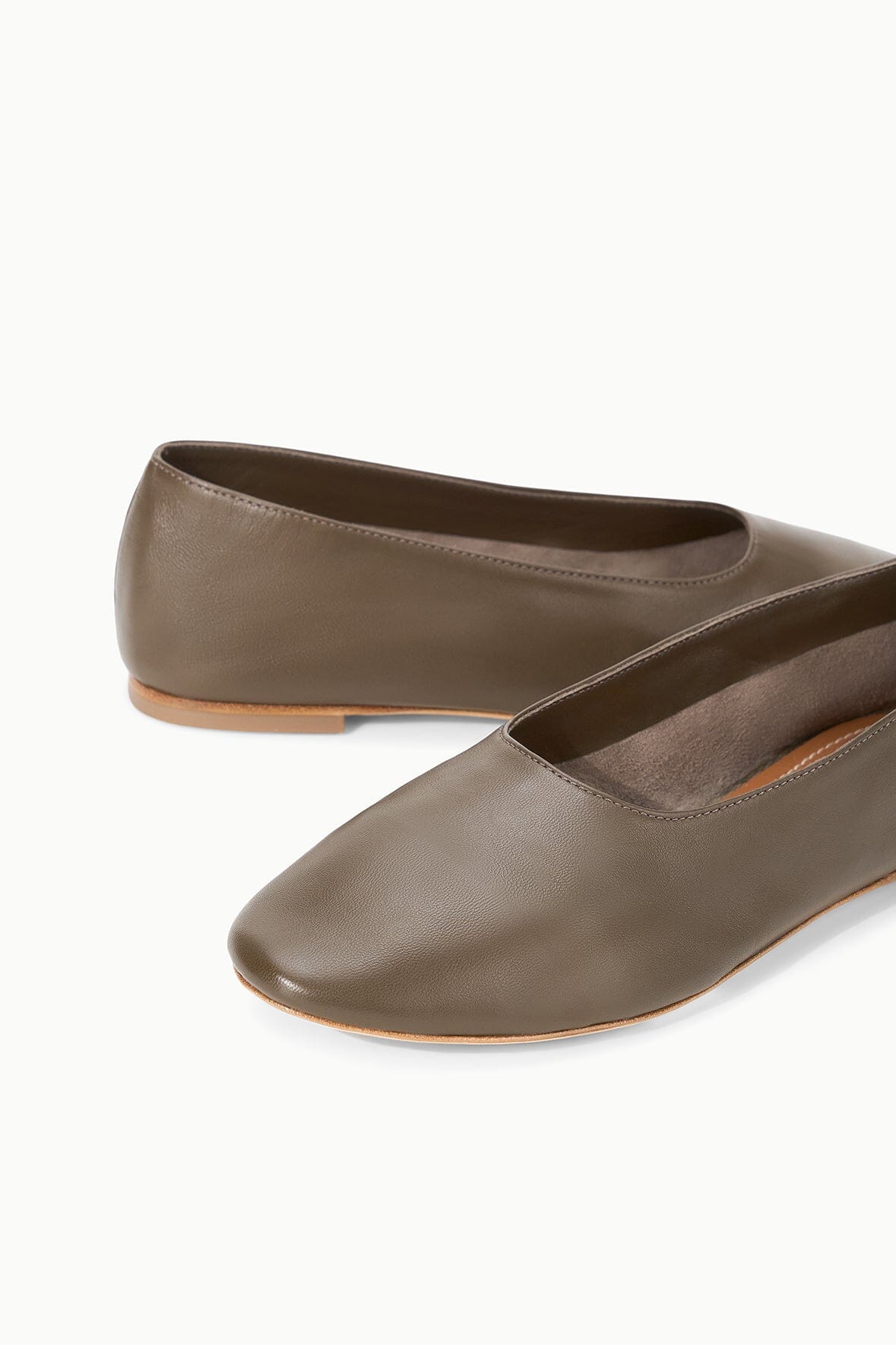 Truffle-brown leather ballet flats, close-up of rounded toe and lining