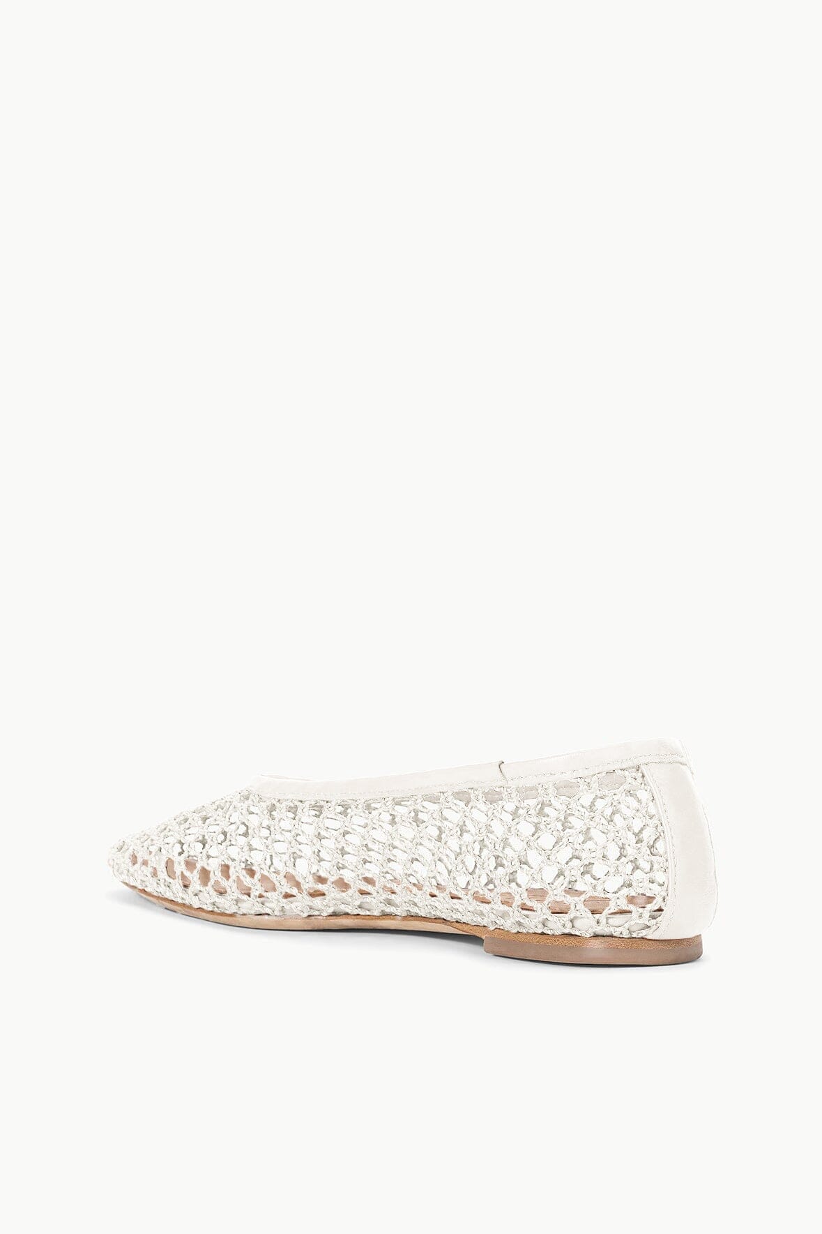 Cream paper netting ballet flat with flexible mesh upper and tan rubber outsole.