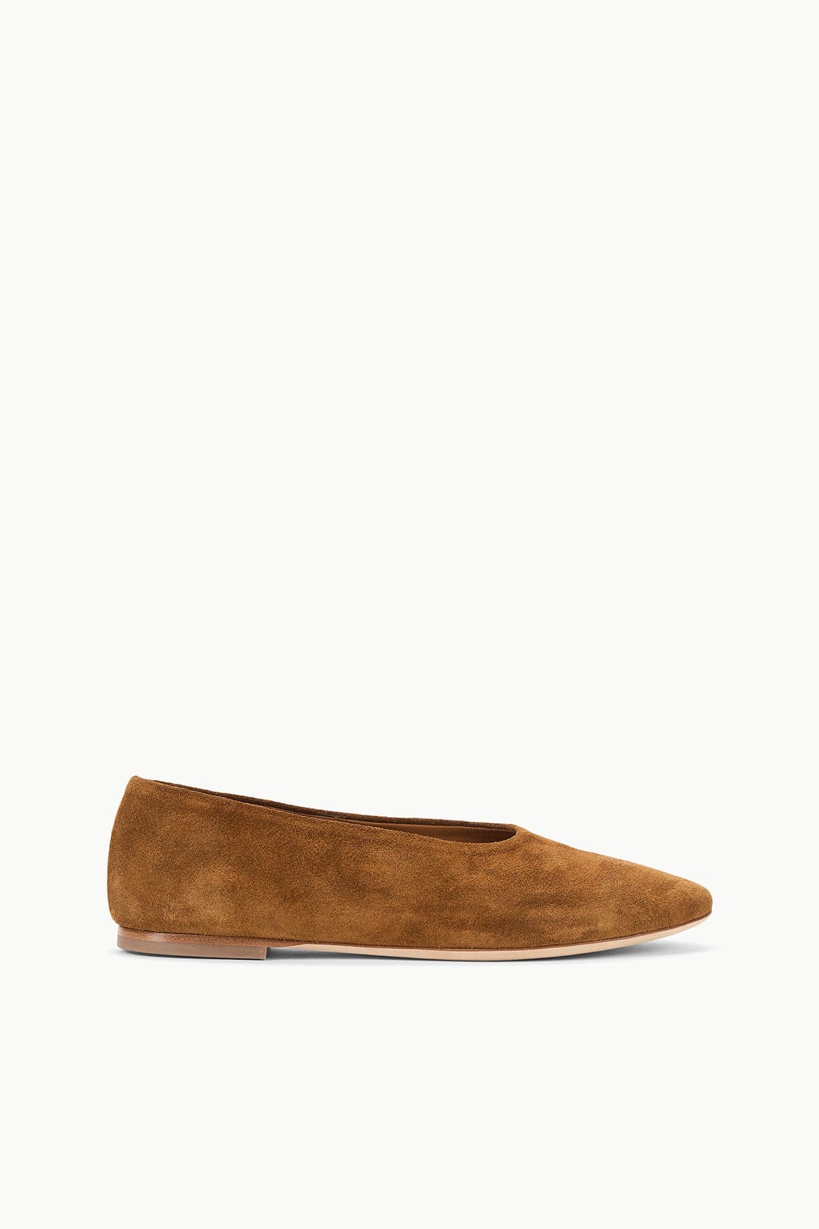 Tan suede ballet flat with curved topline and flat sole