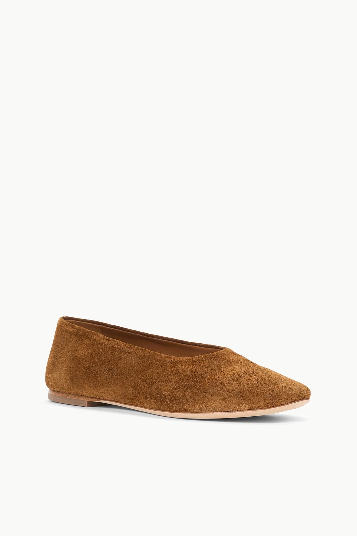 Tan suede ballet flat with pointed toe and flat sole