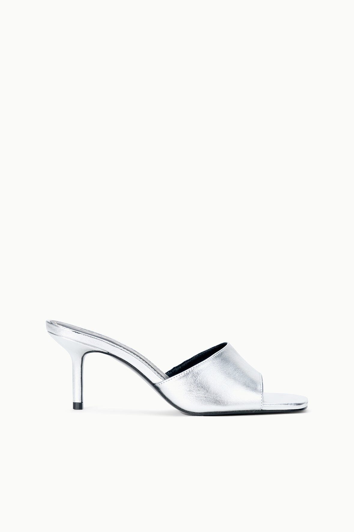 Silver heeled mule sandal with open toe, side view