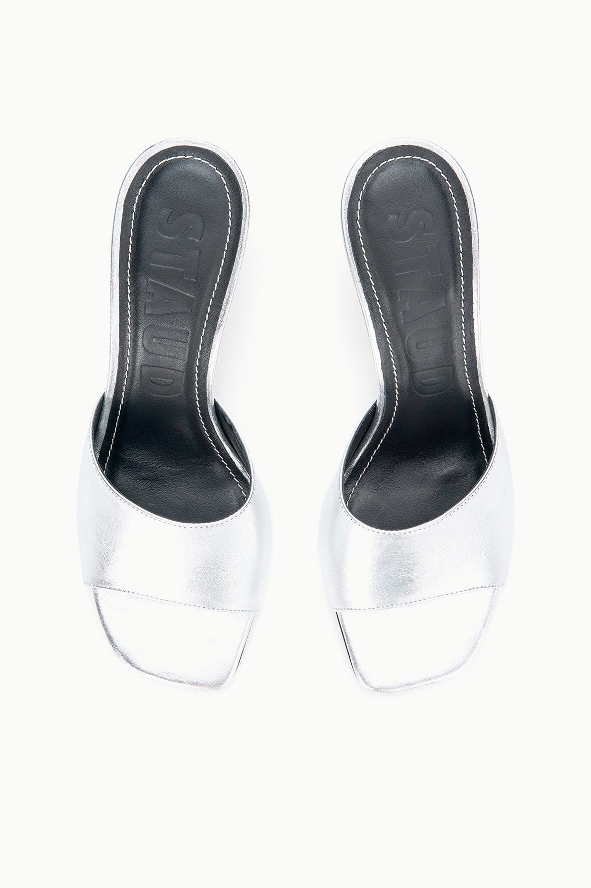 Pair of silver mule sandals, open toe with dark lining