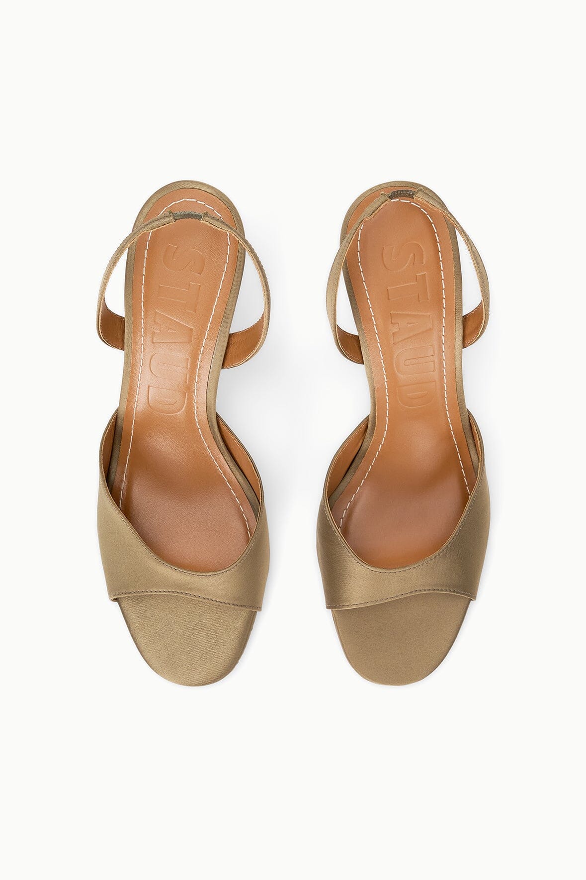 Pair of taupe open-toe slingback heeled sandals with textured footbeds