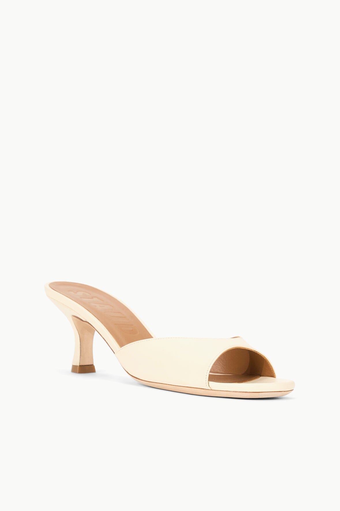 Cream leather open-toe mule with side cutout and heel