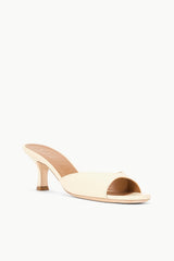 Cream leather open-toe mule with side cutout and heel