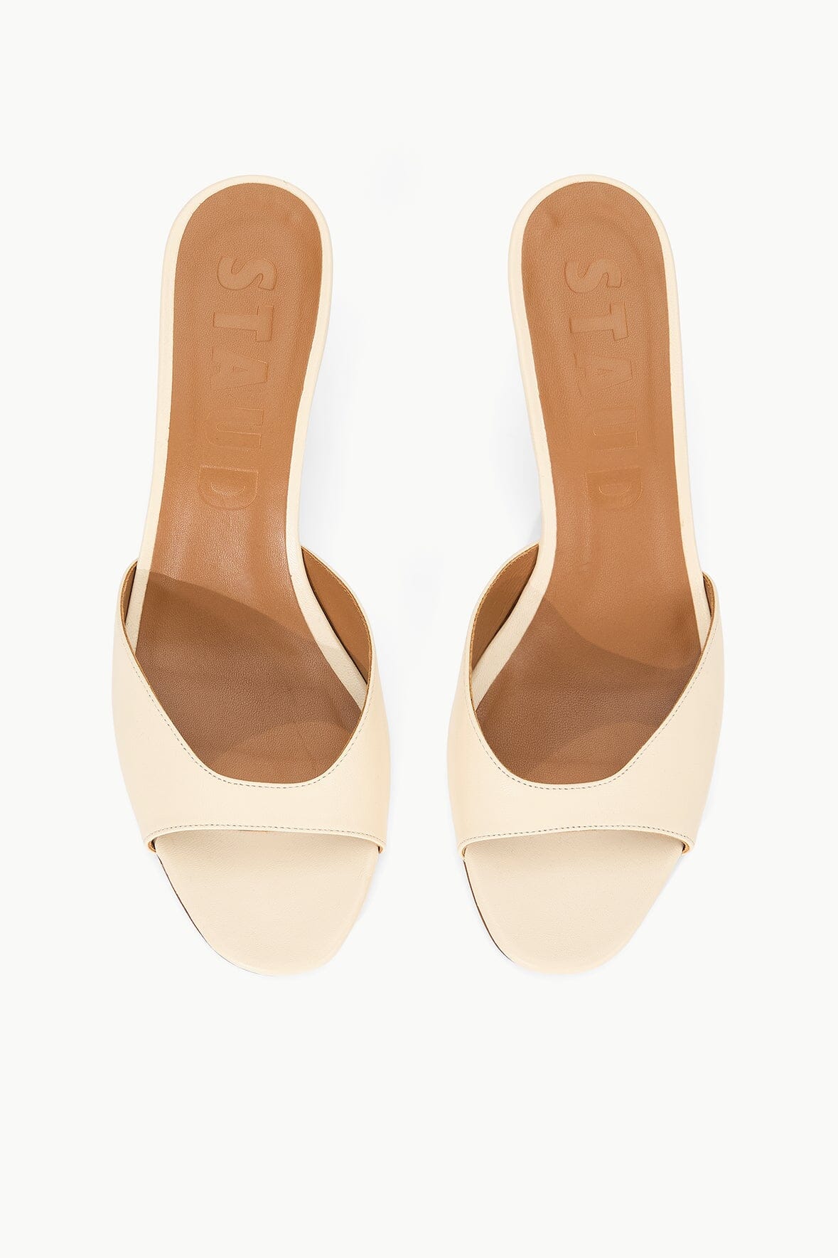 Cream leather mule with open toe and low heel