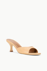 Tan leather heeled mule with open toe and peep-through vamp, side view.