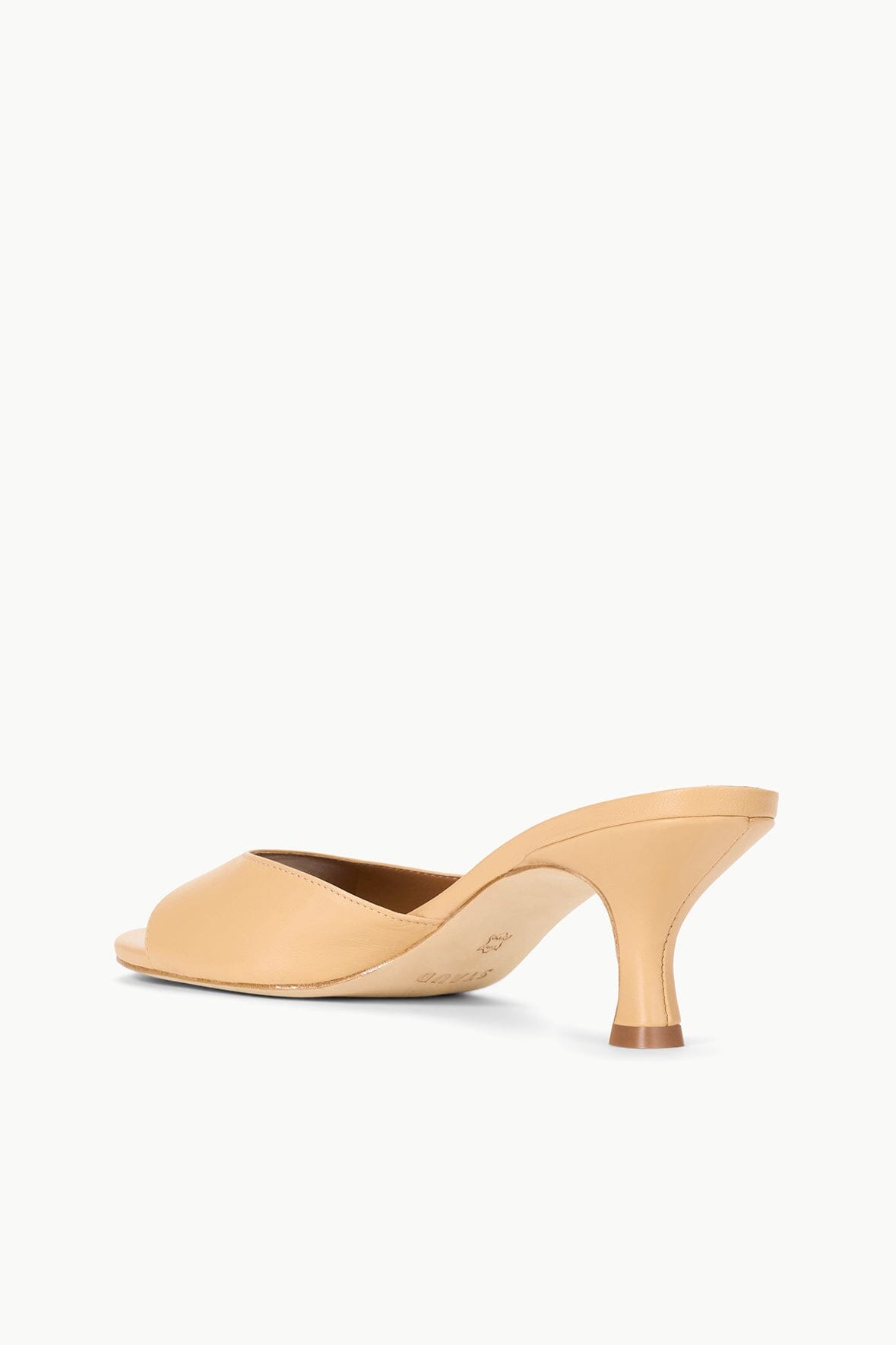 Tan leather slide mule with open toe and mid block heel, angled side view.