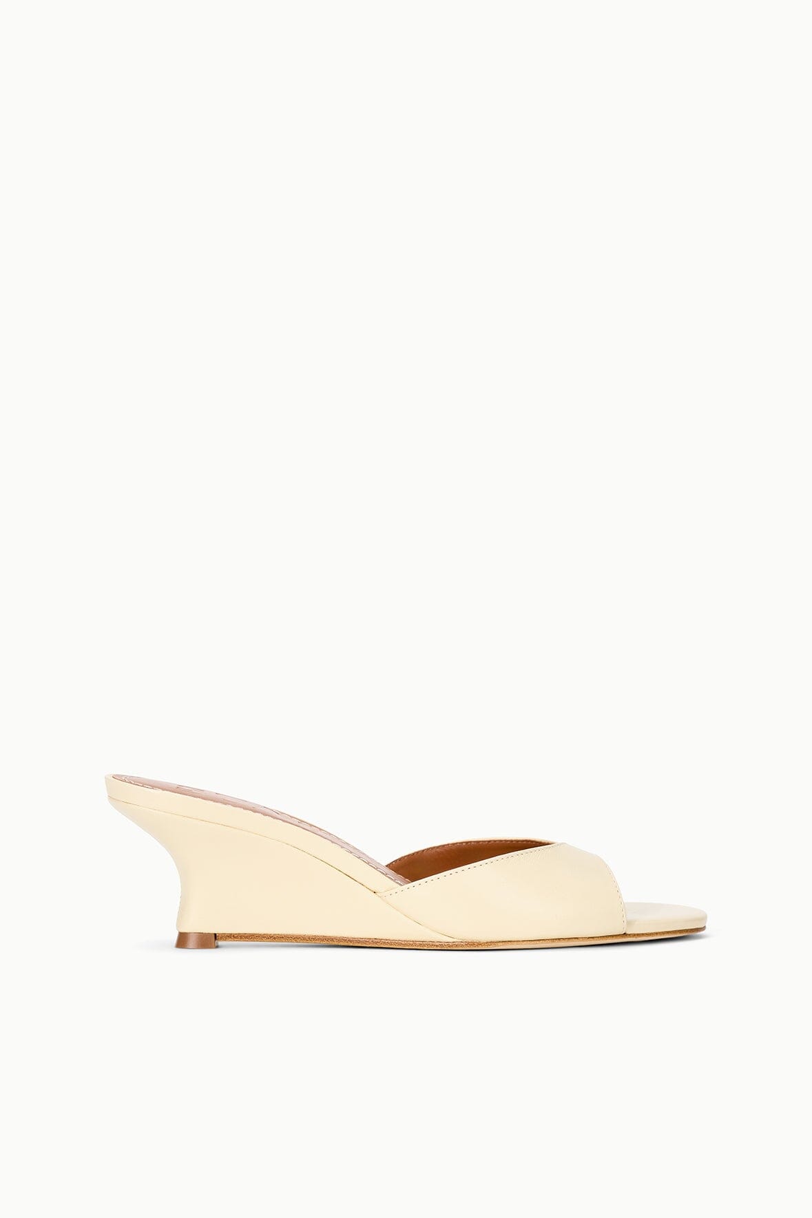 Cream wedge slide sandals with open toe and low platform sole