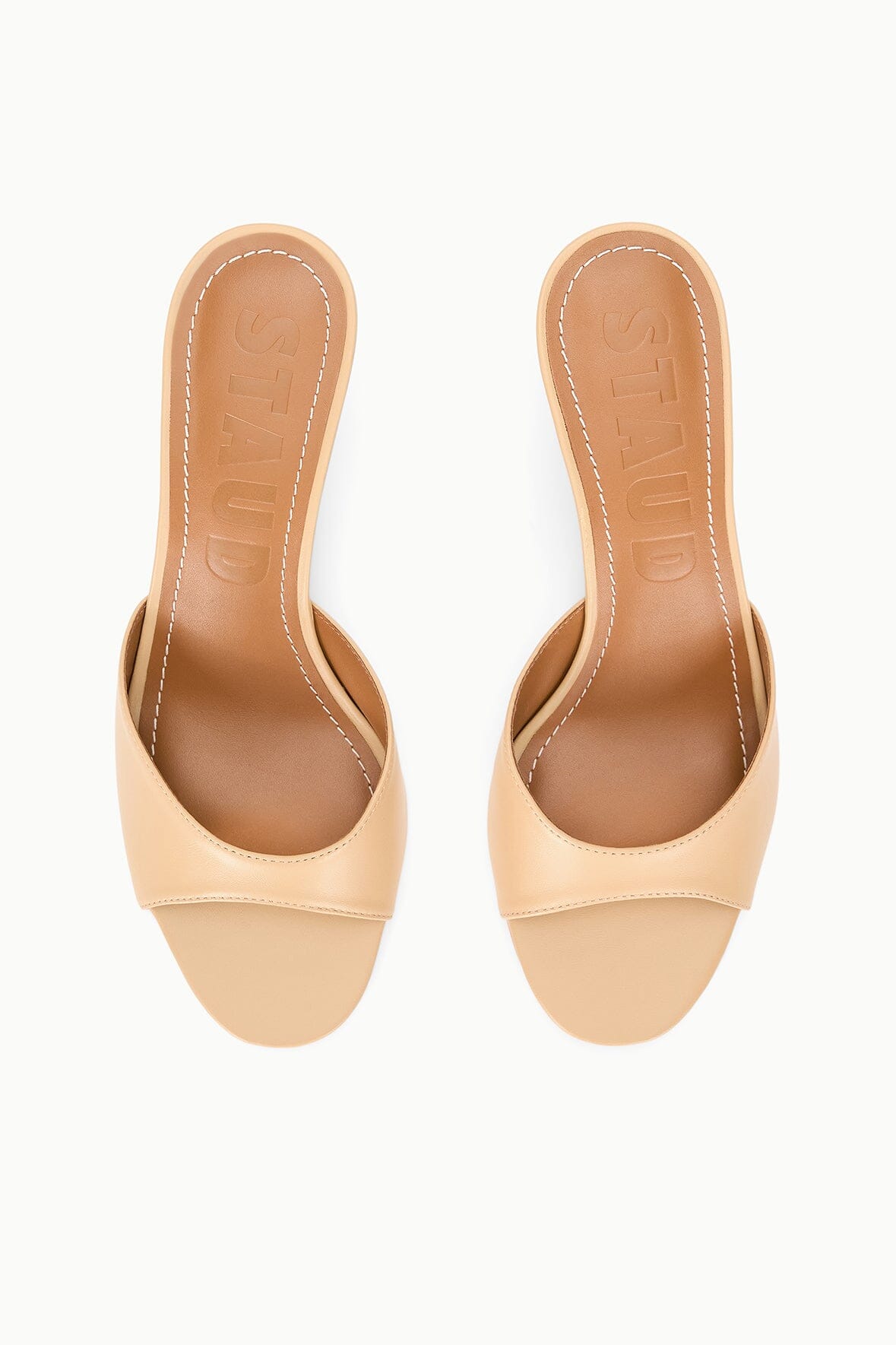 Pair of tan open-toe wedge sandals with contoured footbed