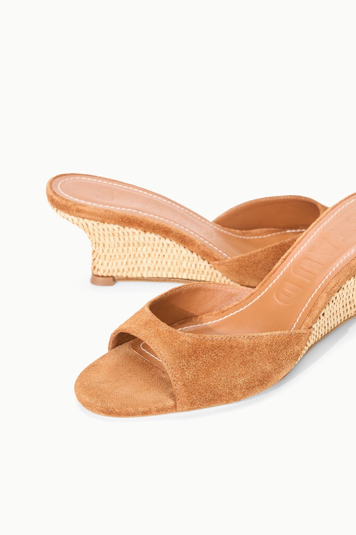 Tan suede wedge slide sandal detail with woven midsole and open toe